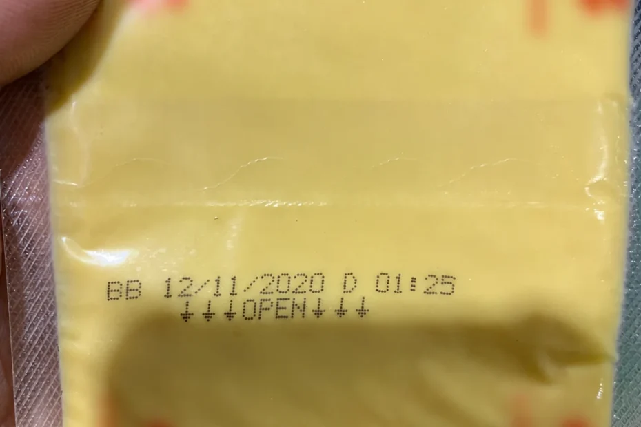 Two-line Hitachi UX-D inkjet code printed on flexible cheese-slice packaging